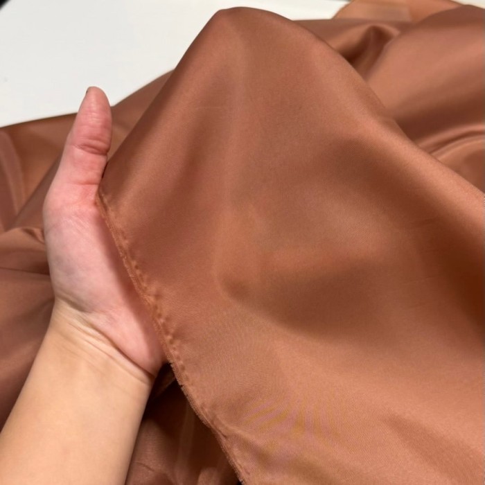 Tissu doublure polyester marron cuivré uni Tissu doublure polyester marron cuivré uni