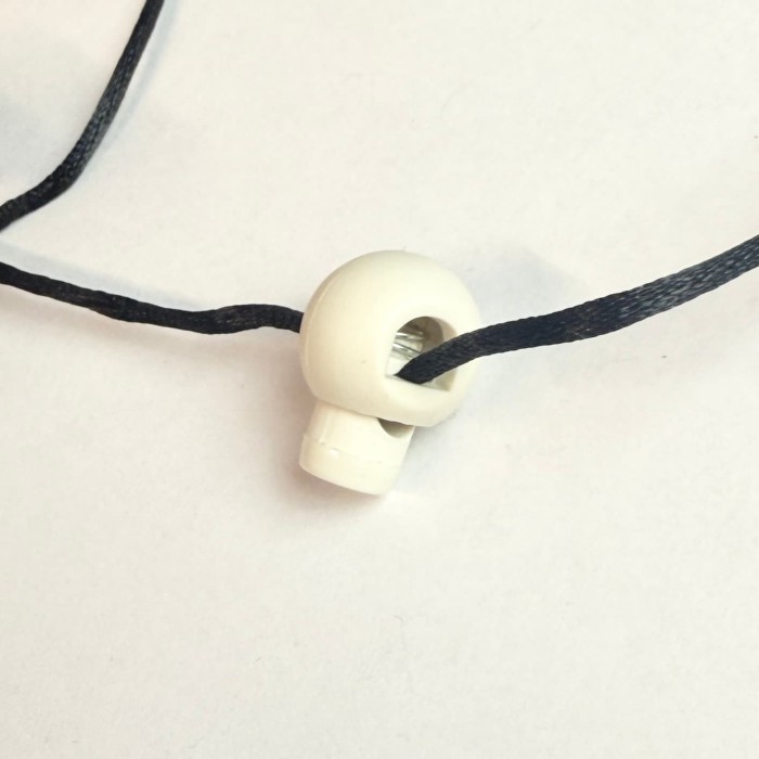 Bloque lacet blanc plastique 15mm