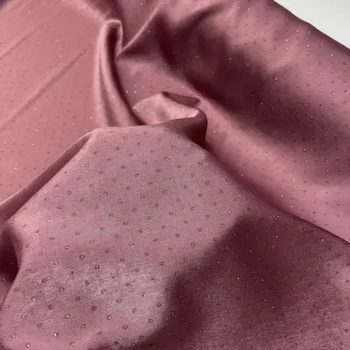 Tissu polyester petit pois dorée rose brillant