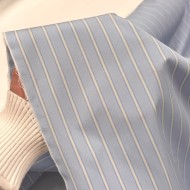 Tissu coton popeline bleu clair poudré à rayures blanches - Haute couture