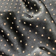 Tissu polyester petit pois dorée noir brillant