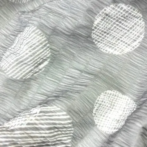 Tissu polyester gros pois blanc gris