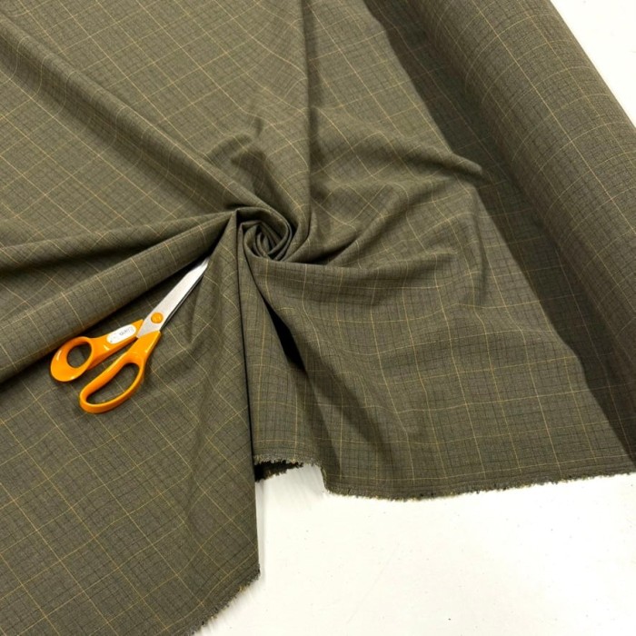 Tissu laine polyamide kaki à carreaux oranges et noirs Tissu laine polyamide kaki à carreaux oranges et noirs