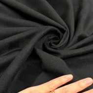 Tissu laine polyester à pois noirs sur fond noir Tissu laine polyester à pois noirs sur fond noir