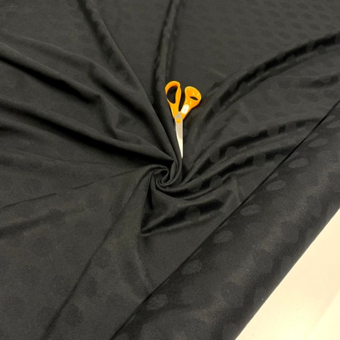 Tissu laine polyester à pois noirs sur fond noir Tissu laine polyester à pois noirs sur fond noir