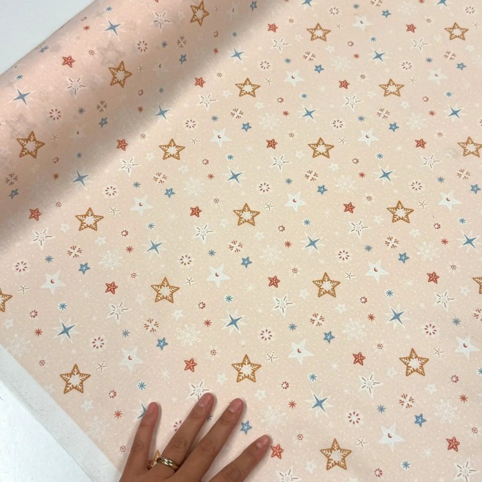 Tissu Coton imprimé étoiles et flocons abricot